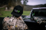 Back shot of a man wearing a Scent Assassin Full Skull Logo hunting cap.